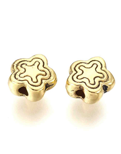 Flores. Aleación de cobre. Color oro antiguo. 7x2,5 milímetros. 1,5 mm perforación. 20 unidades,