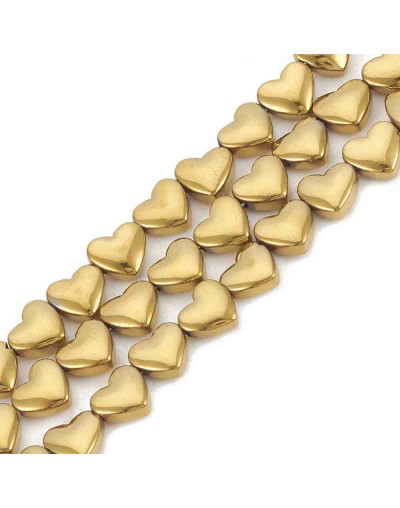 Hematite sintético. Corazón dorado. 6x5,5x3 milímetros. 1 mm perforación. 10 uds