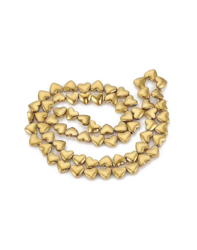 Hematite sintético. Corazón dorado. 6x5,5x3 milímetros. 1 mm perforación. 10 uds