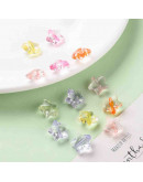 Estrella varios colores. Transparente. 13x14x7,5 milímetros. 1,5 mm perforación. 20 unidades.