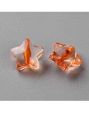 Estrella varios colores. Transparente. 13x14x7,5 milímetros. 1,5 mm perforación. 20 unidades.