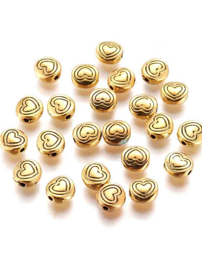Corazón (1). Aleación de cobre. Color oro antiguo. 6x6x3 mm. 1,5 mm perforación. 20 unidades,