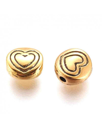 Corazón (1). Aleación de cobre. Color oro antiguo. 6x6x3 mm. 1,5 mm perforación. 20 unidades,