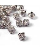 Bicono (1). Aleación de cobre. Color plata antigua. 6,5 mm diámetro. 1 mm perforación. 20 unidades