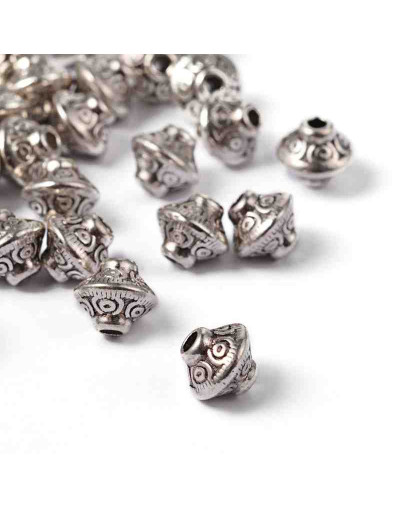 Bicono (1). Aleación de cobre. Color plata antigua. 6,5 mm diámetro. 1 mm perforación. 20 unidades