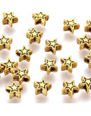 Estrellas (1). Aleación de cobre. Color oro antiguo. 6x6x3 milímetros. 1 mm diámetro. 20 unidades