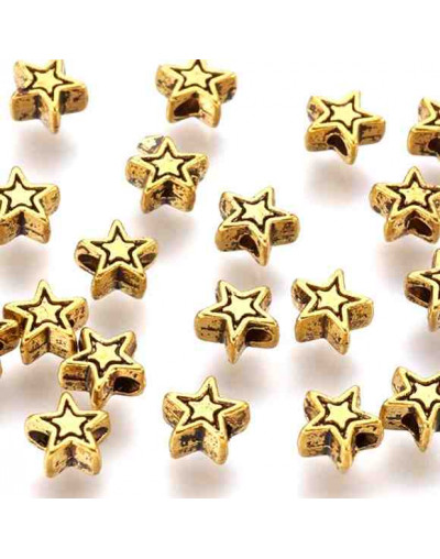 Estrellas (1). Aleación de cobre. Color oro antiguo. 6x6x3 milímetros. 1 mm diámetro. 20 unidades