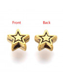Estrellas (1). Aleación de cobre. Color oro antiguo. 6x6x3 milímetros. 1 mm diámetro. 20 unidades