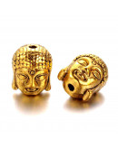 Buddha. Aleación de cobre. Color oro antiguo. 11x9x8 milímetros. 1,5 mm de perforación. 4 unidades