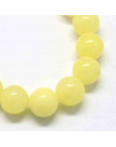 Jade. Amarillo (1). 04 milímetros diámetro. 0,50 mm perforación. 95 unidades hilo (aproximado)