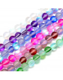 Piedra luna sintética. Colores varios sin pulir. 6 milímetros diámetro. 1 mm perforación. 20 uds.