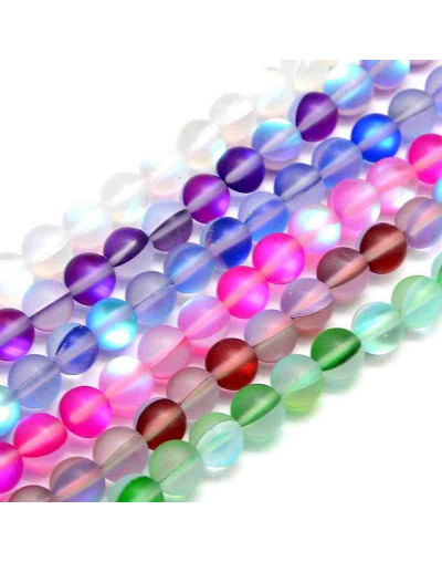 Piedra luna sintética. Colores varios sin pulir. 6 milímetros diámetro. 1 mm perforación. 20 uds.