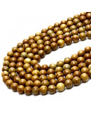 Madera fósil. 04 milímetros diámetro. 0,80 mm perforación. 90 unidades hilo (aproximado)