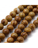 Madera fósil. 08 milímetros diámetro. 1 mm perforación. 45 unidades hilo (aproximado)