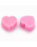 Corazón. Color rosado. 8x9x5 milímetros. 1,2 mm perforación. 10 unidades.