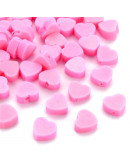 Corazón. Color rosado. 8x9x5 milímetros. 1,2 mm perforación. 10 unidades.