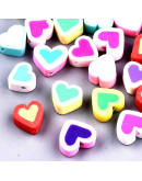 Corazón. Varios colores. 9x9x5 milímetros. 2 milímetros perforación. 10 unidades.