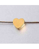 Corazón. Acero inoxidable. Color dorado. 8 milímetros. 2 mm perforación. 1 unidad
