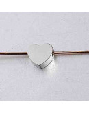 Corazón. Acero inoxidable. Color plateado. 8 milímetros. 2 mm perforación. 1 unidad