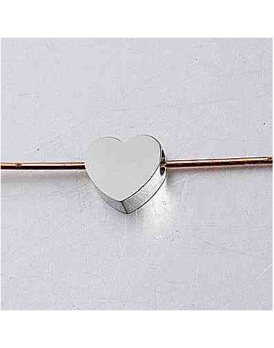 Corazón. Acero inoxidable. Color plateado. 8 milímetros. 2 mm perforación. 1 unidad