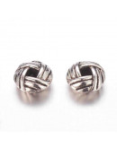 Tibetan beads. Aleación de cobre Color plateado 6x3.2 mm 2 mm perforación 20 unidades