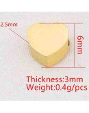 Corazón. Acero inoxidable.Color dorado.6 milímetros 2 mm perforación. 1 unidad