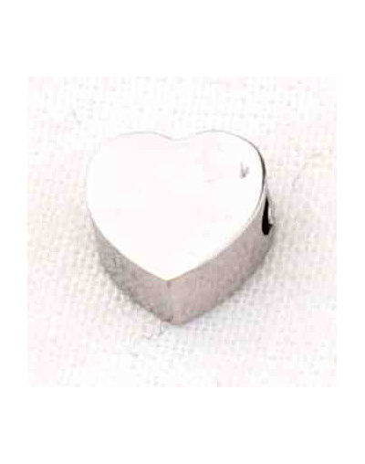 Corazón. Acero inoxidable.Color plateado. 6 milímetros 2 mm perforación. 1 unidad