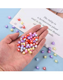 Corazón (5). Varios colores. 7x8x4 milímetros. 2 mm perforación. 50 unidades.