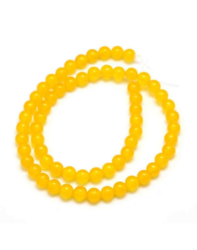 Jade Malaysia. Color amarillo. 06 mm diámetro. 0,8 mm perforación. 60 unidades hilo (aproximado).