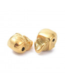 Calavera (2). Acero inoxidable. Color dorado. 14x9,5x9 milímetros. 1,6 mm perforación. 1 unidad.