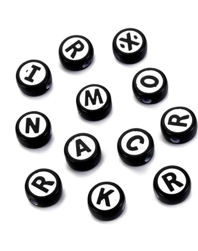 Letra negra. Moneda blanca/negra. 10 milímetros diámetro. 2 mm perforación. 50 unidades (aprox).