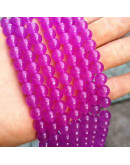 Calcedonia. Magenta. 10 milímetros diámetro. 1 mm perforación. 35 unidades hilo (aproximado).