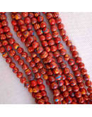 Malaquita sintética. Tonos rojos. 04 mm diámetro. 1 mm perforación. 90 uds hilo (aproximado).