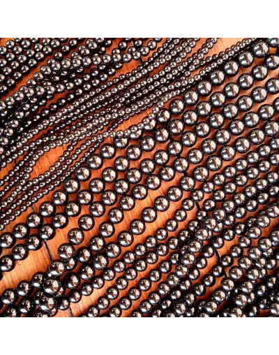 Obsidiana negra. 06 milímetros diámetro. 1 mm perforación. 60 unidades hilo (aproximado).