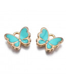 Mariposas (4). Aleación de cobre y esmalte. DARK TURQUOISE. 16x13x2 mm. 2 mm perforación. 4 uds. Mariposas (4). Aleación de cobre y esmalte. DARK TURQUOISE. 16x13x2 mm. 2 mm perforación. 4 uds.