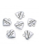 Corazón+Mensaje. Aleación de cobre. Color plata antigua. 15x12x2,5 mm. 1,6 mm perforación. 4 uds. Corazón+Mensaje. Aleación de cobre. Color plata antigua. 15x12x2,5 mm. 1,6 mm perforación. 4 uds.