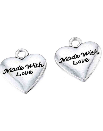 Corazón+Mensaje. Aleación de cobre. Color plata antigua. 15x12x2,5 mm. 1,6 mm perforación. 4 uds.