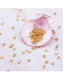 Wire guardians. Aleación de cobre. Color dorado. 4,5x4x1 mm. 0.50 mm perforación. 50 uds (aprox).