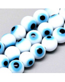 Ojo turco. Esfera. Color blanco. 06 milímetros diámetro. 1 mm perforación. 60 unidades hilo (aprox.) Ojo turco. Esfera. Color blanco. 06 milímetros diámetro. 1 mm perforación. 60 unidades hilo (aprox.)