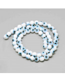 Ojo turco. Esfera. Color blanco. 08 milímetros diámetro. 1,5 mm perforación. 45 uds hilo (aprox.) Ojo turco. Esfera. Color blanco. 08 milímetros diámetro. 1,5 mm perforación. 45 uds hilo (aprox.)