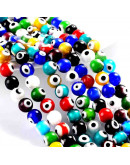 Ojo turco. Esfera. Colores variados. 04 milímetros diámetro. 1 mm perforación. 90 uds hilo (aprox.) Ojo turco. Esfera. Colores variados. 04 milímetros diámetro. 1 mm perforación. 90 uds hilo (aprox.)