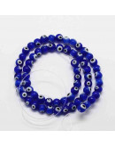Ojo turco. Esfera. Color azul. 08 milímetros diámetro. 1 mm perforación. 45 unidades hilo (aprox.) Ojo turco. Esfera. Color azul. 08 milímetros diámetro. 1 mm perforación. 45 unidades hilo (aprox.)