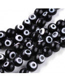 Ojo turco. Esfera. Color negro. 04 milímetros diámetro. 1 mm perforación. 90 unidades hilo (aprox.) Ojo turco. Esfera. Color negro. 04 milímetros diámetro. 1 mm perforación. 90 unidades hilo (aprox.)