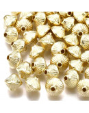 Bi-cono. Color Ligth Gold. 7x6 milímetros. 1,5 mm perforación. 50 unidades aproximado.