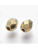 Ovalo faceteado. Color dorado. 5x4x4 milímetros. 1,4 mm perforación. 50 unidades aproximado.