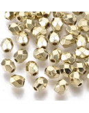 Ovalo faceteado. Color dorado. 5x4x4 milímetros. 1,4 mm perforación. 50 unidades aproximado.