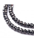 Rondelle faceteado. 2x1,5 mm. GUNMETAL PLATED. 0,6 mm perforación. 220 uds hilo (aproximado).