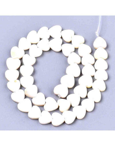 Concha de mar. Corazón. 8x8x2,5 milímetros. 0,80 mm de perforación vertical. 1 unidad.