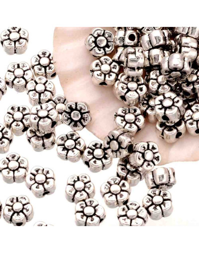 Flor (2). Aleación de cobre. Color plata antigua. 5 mm diámetro. 1 mm perforación. 20 unidades.