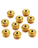 Rondelle (6). Aleación de cobre. Color dorado. 8x4 milímetros. 1,5 mm perforación. 20 unidades.